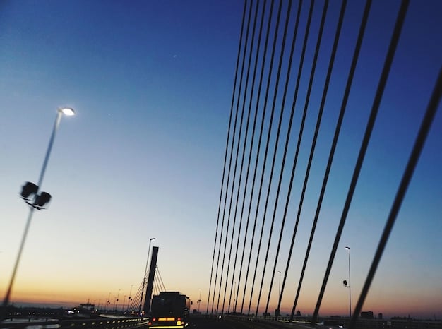A panoramic view of the Lisbon skyline at sunset, with modern office buildings symbolizing the presence and growth of fintech companies in Portugal's financial sector.
