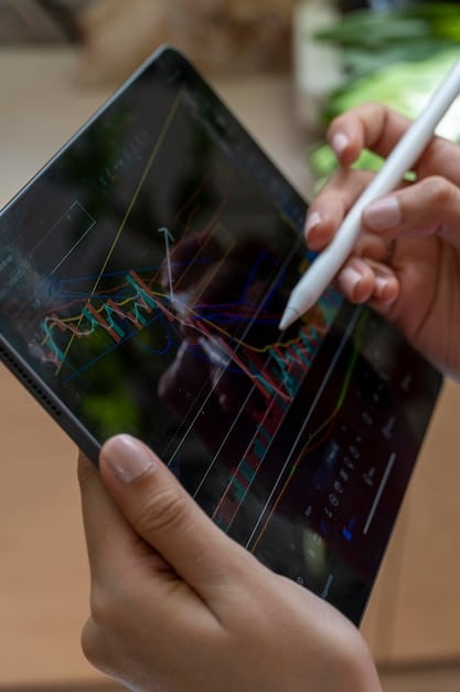 A person using a tablet to analyze financial data, with charts and graphs displayed on the screen, representing the ease of access to investment information under Open Finance.