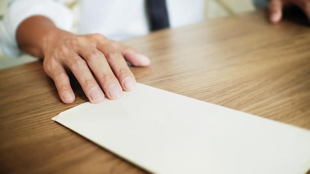 Close-up of hands shaking over a table with a contract. The background is blurred, featuring an office setting and natural light streaming through the windows, suggesting a business or lending agreement.