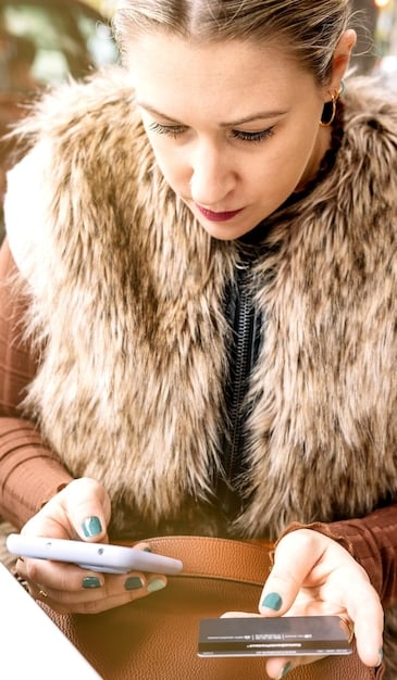 A close-up image displaying a person using a budgeting app on their smartphone. The app interface shows a clear breakdown of income and expenses, highlighting areas where savings can be made to allocate funds for investing.