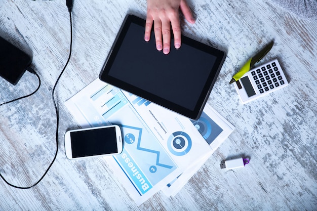A person browsing salary information on a laptop, surrounded by graphs and data. The scene should emphasize the importance of research and informed decision-making in salary negotiation.