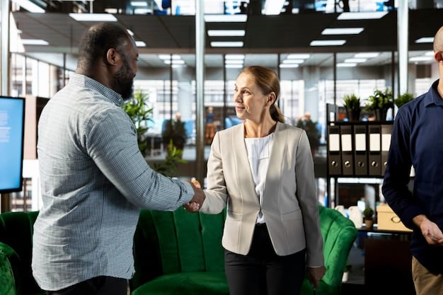 Two people shaking hands after a successful negotiation in a bright and collaborative office environment. The image should evoke a sense of mutual respect and satisfaction.