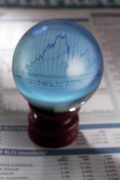 A close-up of different types of investment certificates and bonds with financial charts in the background, symbolizing low-risk investment options for beginners.