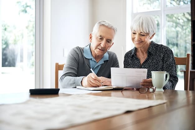 Senior couple happily planning their finances for retirement at home